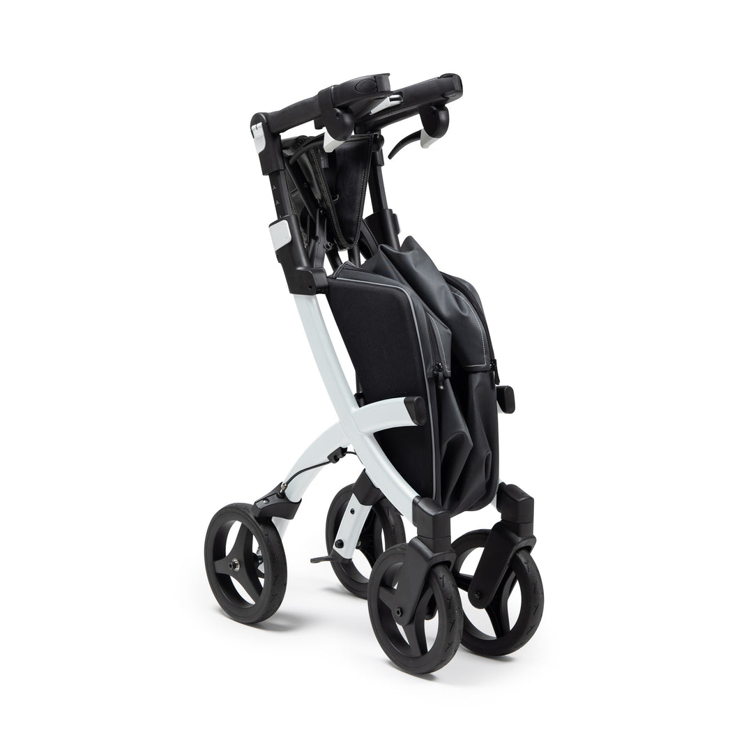 A modern 'Rollz Flex' walker with an attached shopping bag, folded for storage, on a white background.