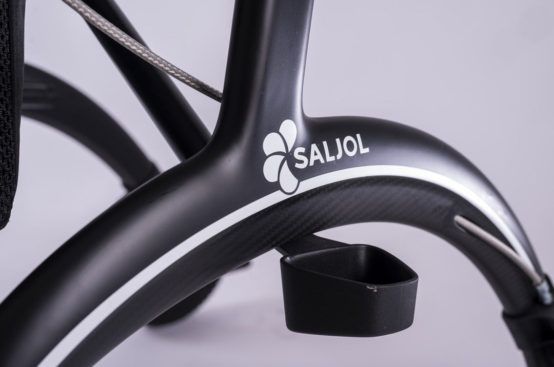 A close up of the Saljol logo on a matt back walker rollator