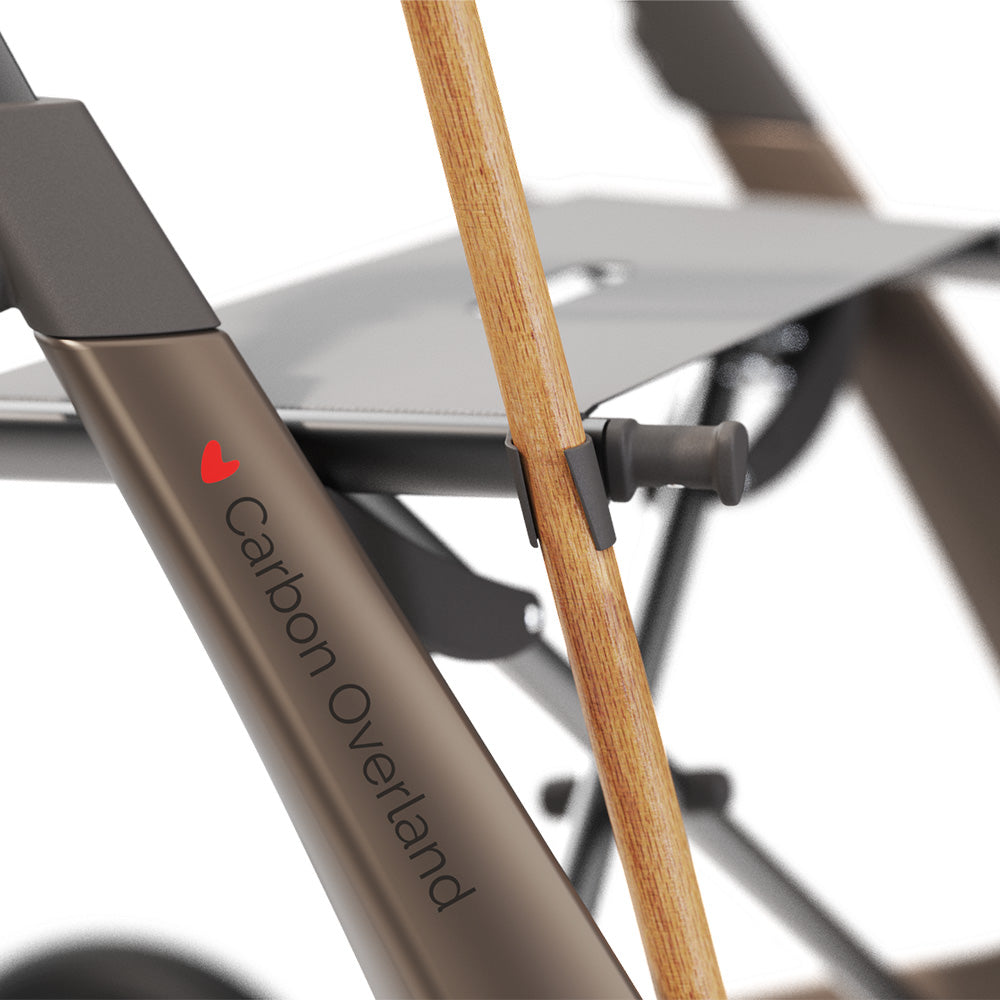 Close up of a walking cane holder attached to a walking frame