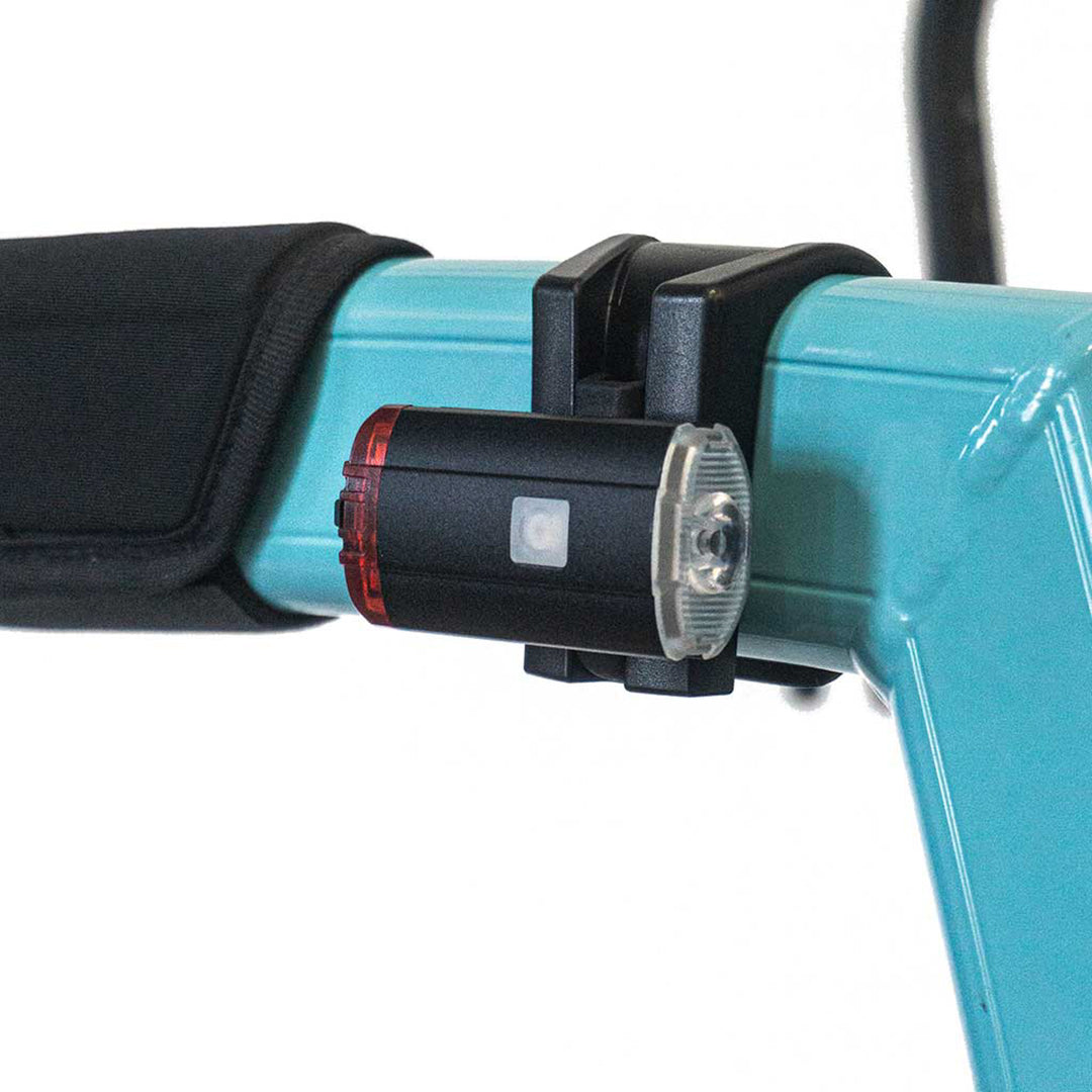 Close up of a Rollz Motion light on a blue rollator, on a white background
