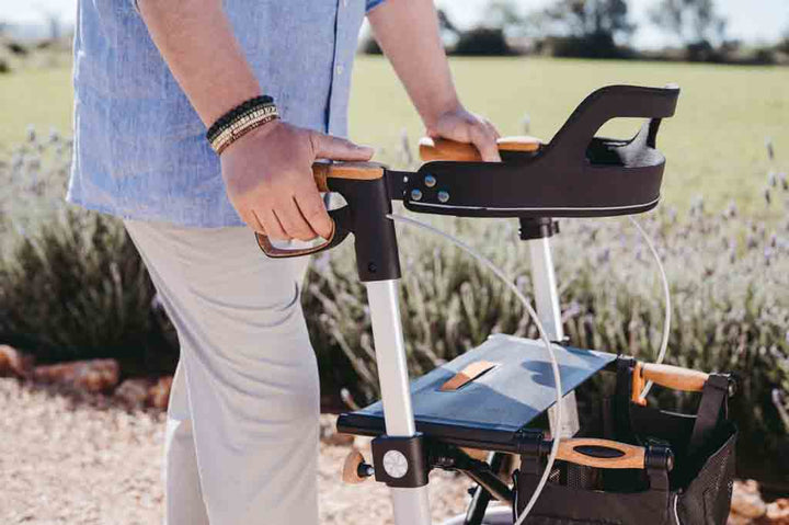 CLose up of the handles of a Saljol Walking frame