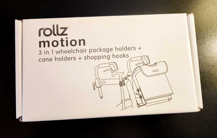 The box that contains a 3-in-1 wheelchair package accessory that is designed to fit on a Rollz Motion Walking frame
