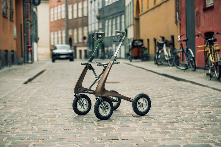 the 'byACRE Overland' walker on a brick lane street in Copenhagen