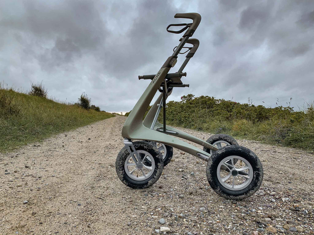 A 'byACRE Overland' walking frame on a dirt road