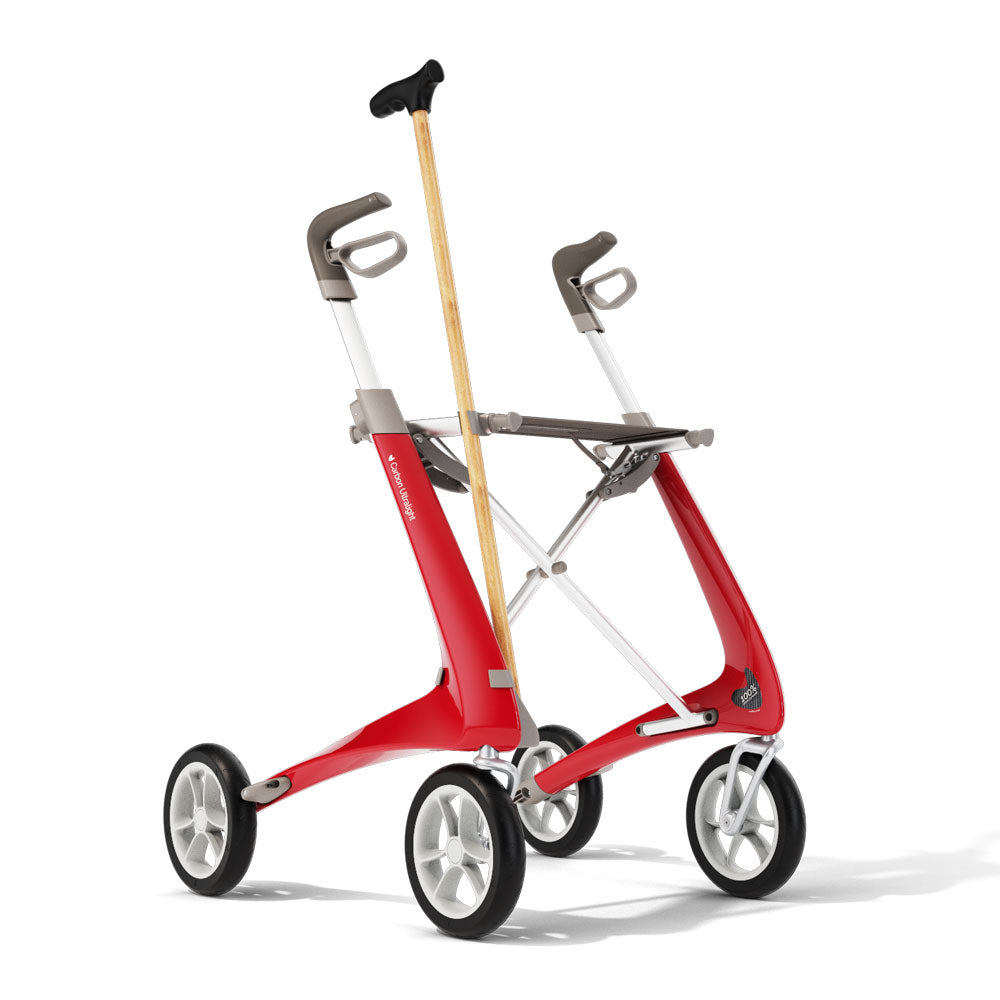 A byACRE Carbon Ultralight rollator with a walking cane attached on a white background