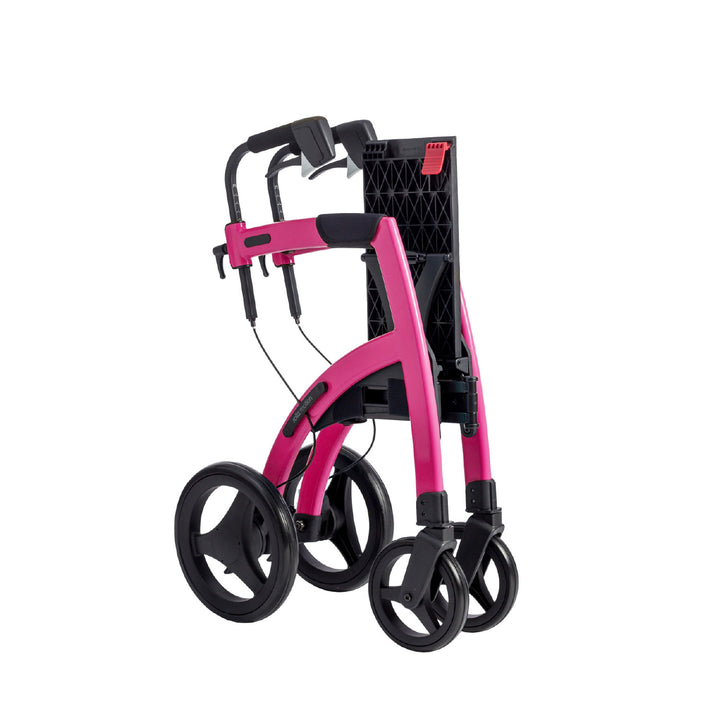 The Candy Pink colour Rollz Motion 2-in-1 walker wheelchair on a white background