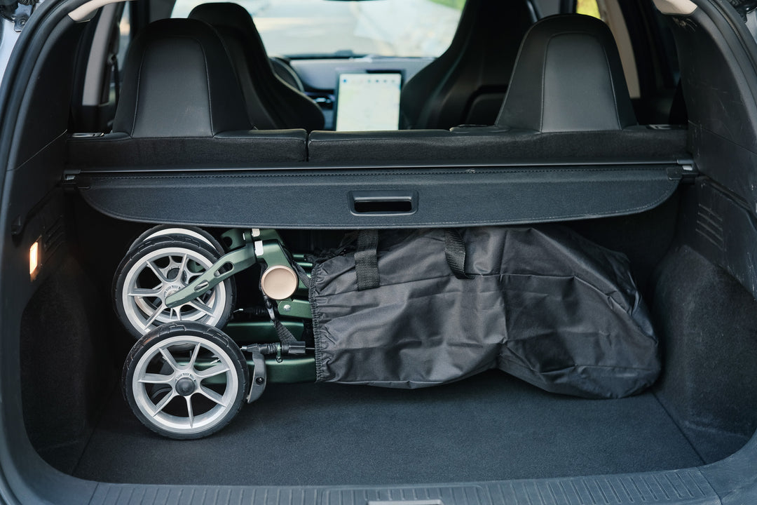 The 'Uplivin Trive' rollator walker is folded and stored inside a car boot.